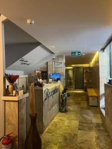 a lobby of a restaurant with a counter and a room at Grand Horizon Apart Hotel in Alanya