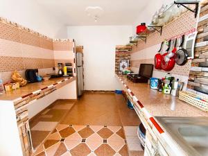 a kitchen with a counter and a sink at calm stay ouassane in Essaouira +6 photos