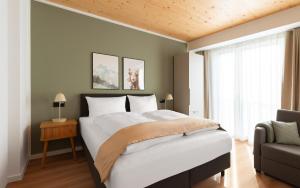a bedroom with a large bed and a window at Limehome Mannheim City Center in Mannheim +41 photos