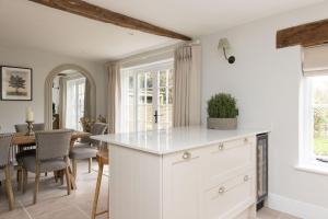 a kitchen and dining room with a table and chairs at The Nook by The Butler Collection in Petworth +39 photos
