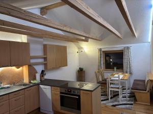 a kitchen with a sink and a stove top oven at Ferienwohnung Philipp in Leutasch
