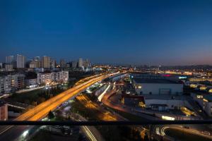 a view of a city at night with traffic at Wish More Hotel Istanbul in Istanbul