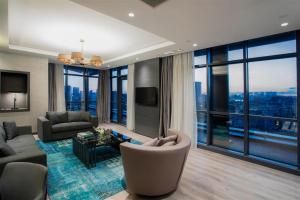 a living room with a view of a city at Wish More Hotel Istanbul in Istanbul