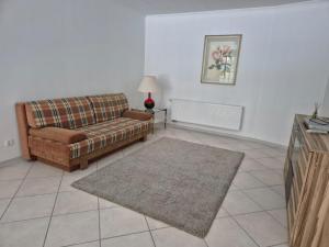 a living room with a couch and a rug at Brull in Lengerich