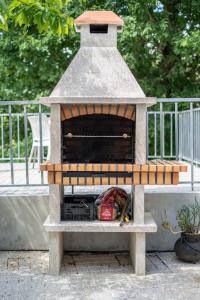 a bird house sitting on top of a patio at Sousa Horizonte - Louredo in Vieira do Minho