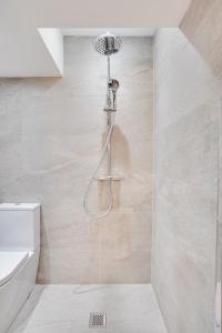 a shower in a bathroom with a toilet at Apt 1 Armatage Flats, Eyemouth in Eyemouth +22 photos