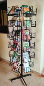 a rack of colorful kites on a wall at Hotel Sunrise, Panchgani in Panchgani +37 photos