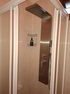 a bathroom with a shower with a glass door at Solo Tranquilidad in Mocanal +10 photos