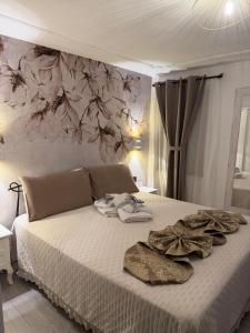 a bedroom with a bed with towels on it at Palazzo Carignano in Chioggia