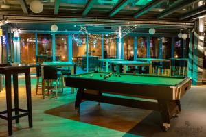 a billiard room with a pool table at SOLEWERK Hotel in Bad Salzungen