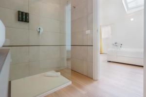 a bathroom with a shower with a bench in it at Admayora Guest House in Villasimius +137 photos