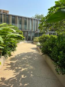 a building with a walkway in front of a building at The Lennox D-Plus Apartments in Accra