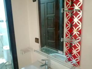 a bathroom with a sink and a mirror at اقامة الشام in Laayoune