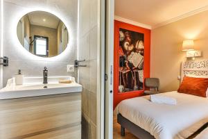 a bathroom with a sink and a mirror at Welcome to Villa Floréal Your tranquil retreat with spa in Saint-Gilles-Croix-de-Vie +34 photos