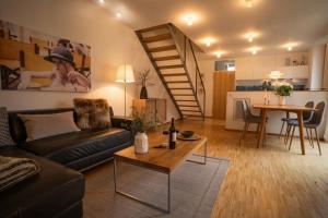 a living room with a couch and a table at An der Kirchtreppe in Blankenburg