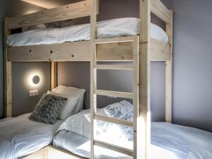 a bunk bed room with two bunk beds in it at Chezgege in Valloire