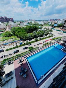 a large swimming pool on top of a building at The Elite Ohana in Lucknow