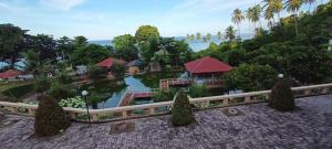 an aerial view of a resort with trees and water at Mata Ie Resort in Sabang