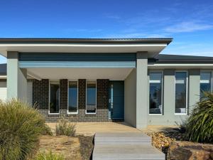 a rendering of a house with a blue door at Paradise Stay in North Wagga