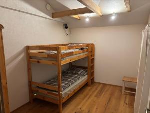 a room with two bunk beds in it at Ferienwohnung Philipp in Leutasch