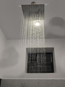 a water fountain in a room with a window at Om Coast Gokarna in Gokarna