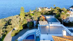 an aerial view of a house next to the ocean at Villa Salomon- Seafront Villa with Private Pool in Plaka