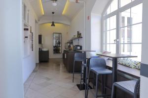 a restaurant with tables and chairs in a room at AMS Rooms in Ljubljana