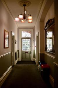 a hallway with a door and a chandelier at Sure Hotel by Best Western Reading in Reading