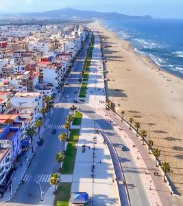 an aerial view of the beach and buildings at Martil Beach Apartment in Martil
