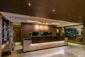 a lobby with a coca cola sign on the wall at Chateau Laghetto Collection Oficial in Gramado