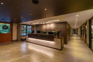 a lobby with a reception desk in a building at Chateau Laghetto Collection Oficial in Gramado
