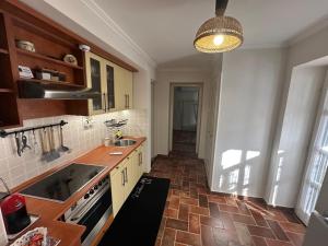 a kitchen with a sink and a counter top at Casa Eloria in Békéscsaba