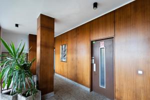 a elevator in a building with a potted plant at Itsas aurre Basquenjoy in Fuenterrabía