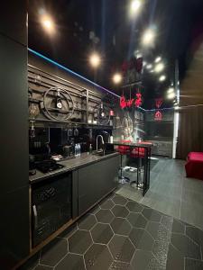a kitchen with a stove and a table in it at Angels Spa & Massage by Secret Apartaments in Gdańsk