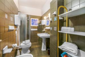 a bathroom with a sink and a toilet and a sink at Grange Studio - Happy Rentals in Grange Sises