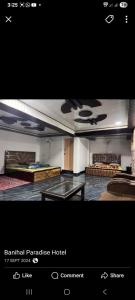 a picture of a hotel room with a glass table at Paradise Banihal Hotel in Banihāl