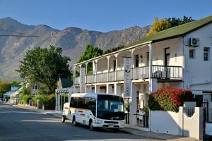 a white van parked in front of a building at Mimosa Lodge in Montagu
