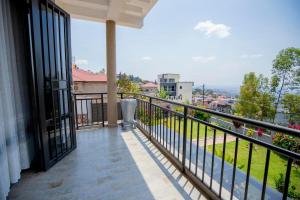 a balcony with a view of a city at Villa d'exception Rebero in Kigali +19 photos