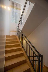a staircase in a house with a window at Villa d'exception Rebero in Kigali