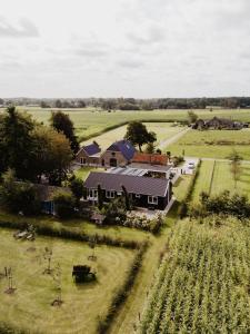 an aerial view of a farm with a house at Huize Henk in Emst