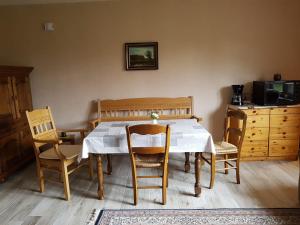 a dining room with a table and two chairs at Omas Stübchen - Monteurwohnung auf dem Land in Borken