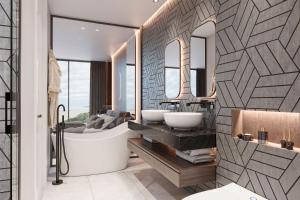 a bathroom with two sinks and a bath tub at Villa Boka in Lapčići
