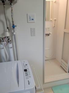 a room with a machine in a room at バーニングハーツ in Asahikawa +9 photos