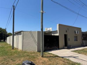 a building with its door open on a street at Ms3M casa in San Pedro +2 photos