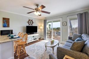 a living room with a couch and a table at SC217A: 217A Sea Cabin in Isle of Palms