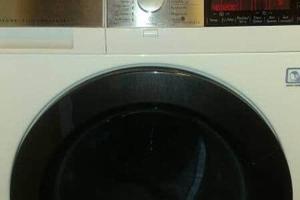 a close up of a white washing machine at Dachgeschosswohnung in historischem Monument in Görlitz