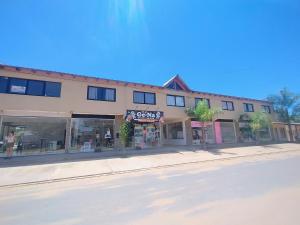 an empty street in front of a building at Rdsa Paso in Paso de la Patria +4 photos