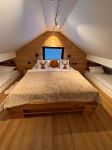 a bedroom with a large bed in a attic at Haus Orion in Eupen