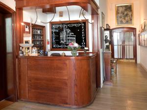 a restaurant with a bar in a room at Hotel Kronprinz in Bad Salzdetfurth +21 photos