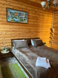 a bedroom with two beds in a log cabin at Chalet Mlyn in Migovo +81 photos